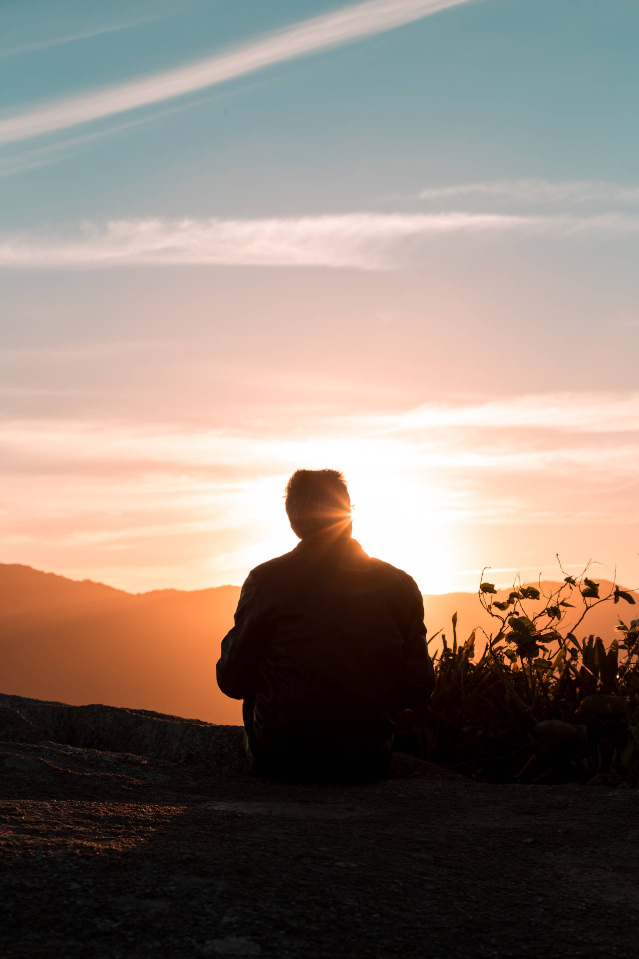 Silhouette Of Man Sitting Alone Background