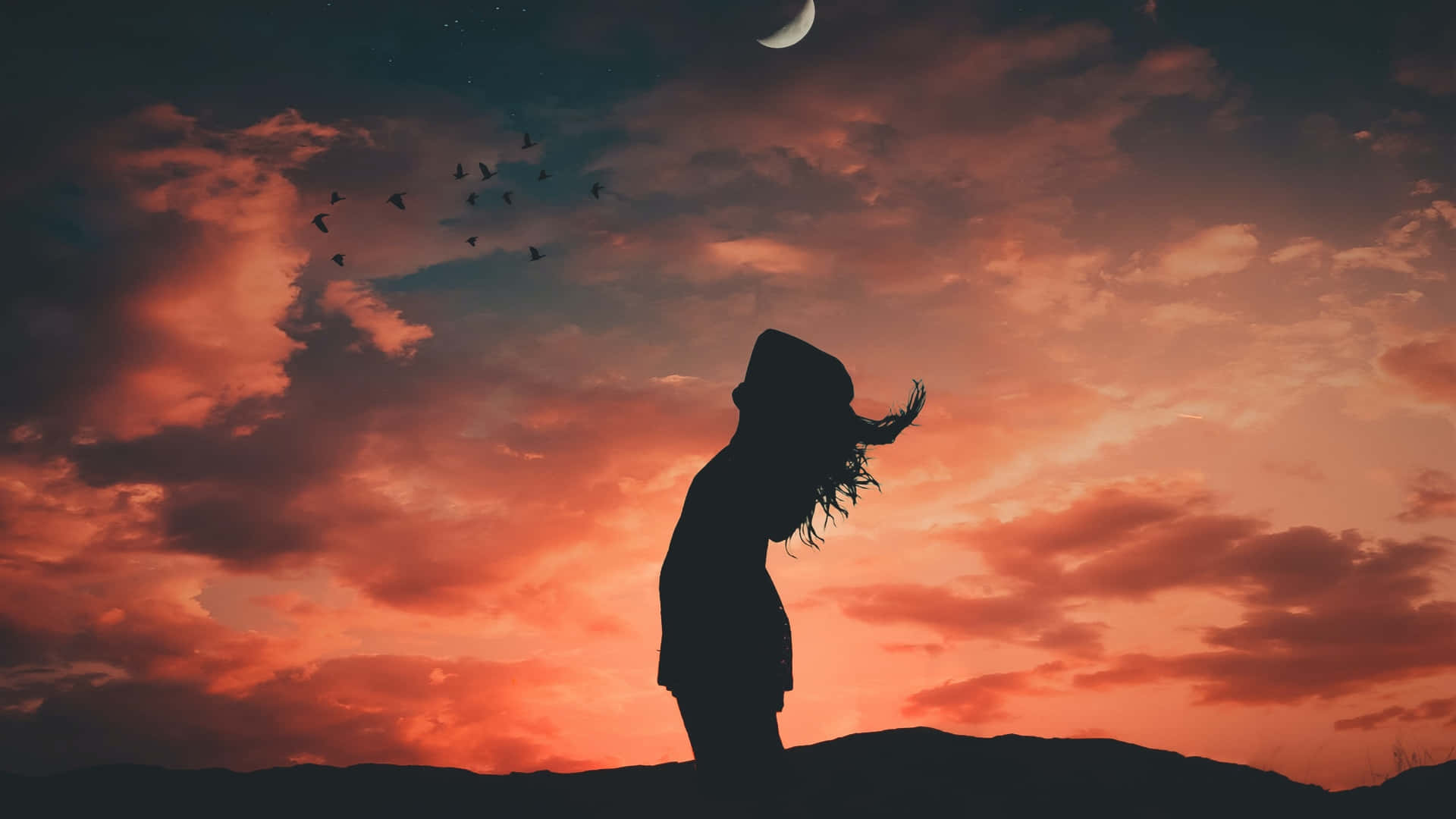 Silhouette Of Woman Under Evening Sky Wallpaper