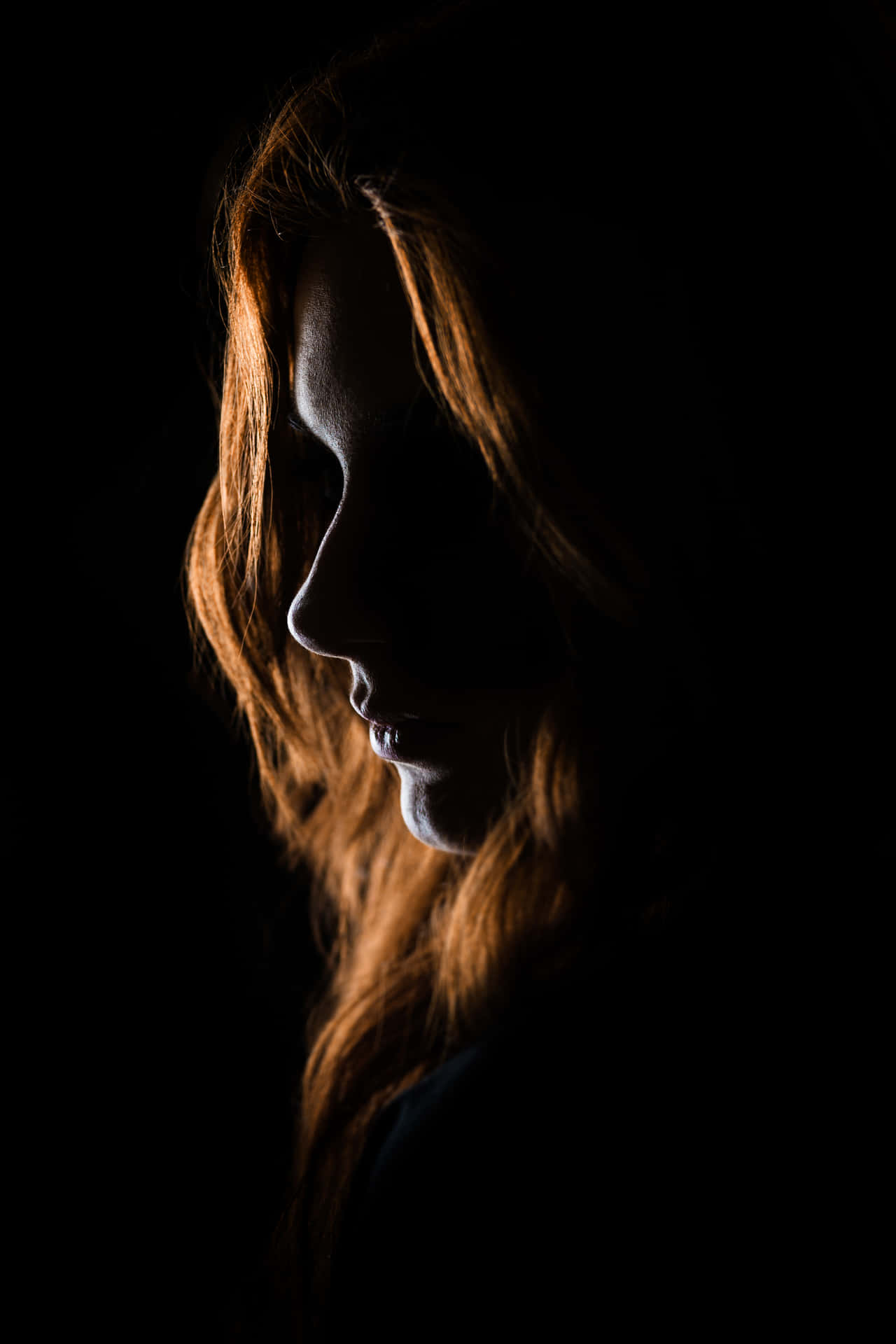 Serene Silhouette of a Woman's Face Wallpaper
