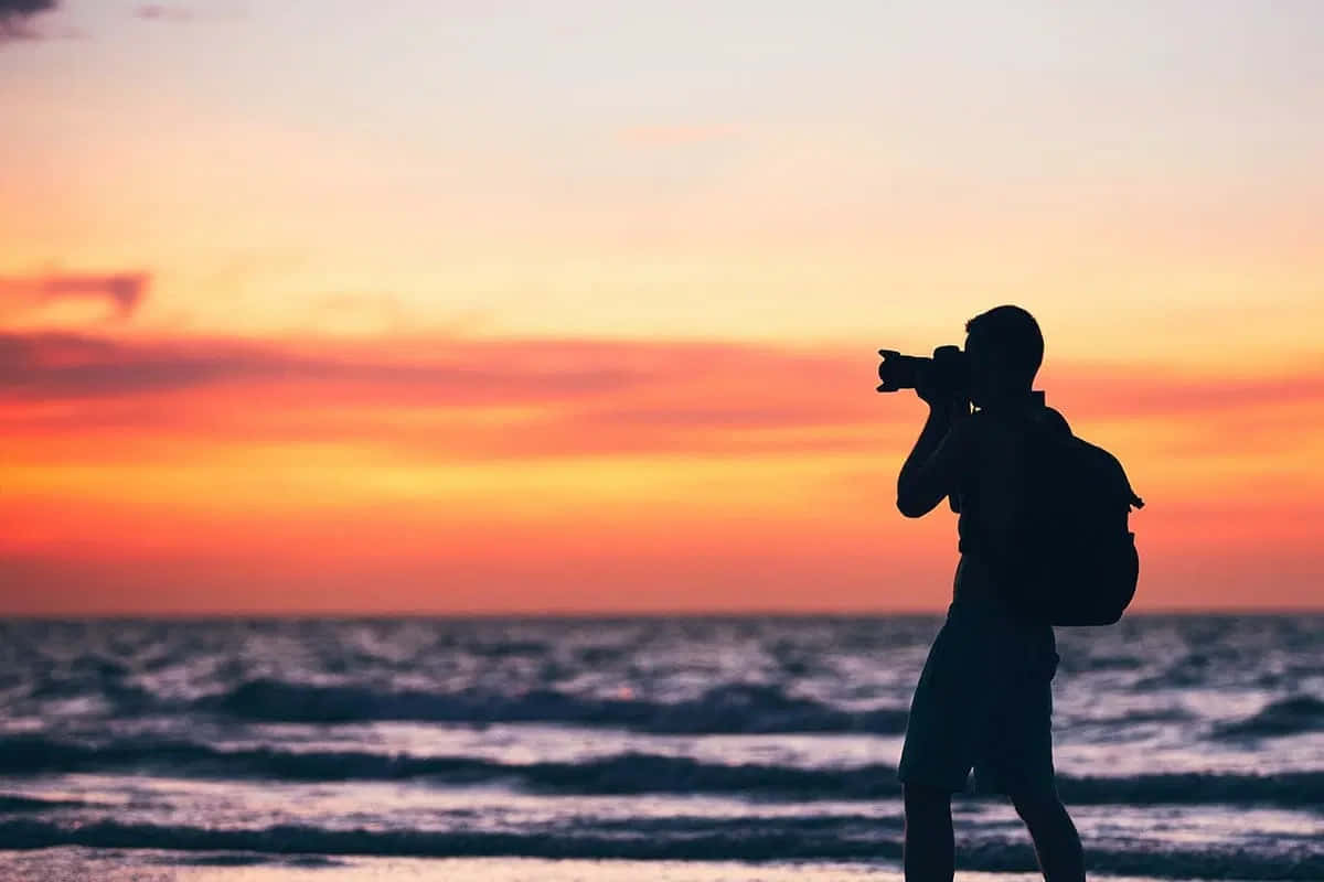 Silhouette Photographer Sunset Beach.jpg Wallpaper