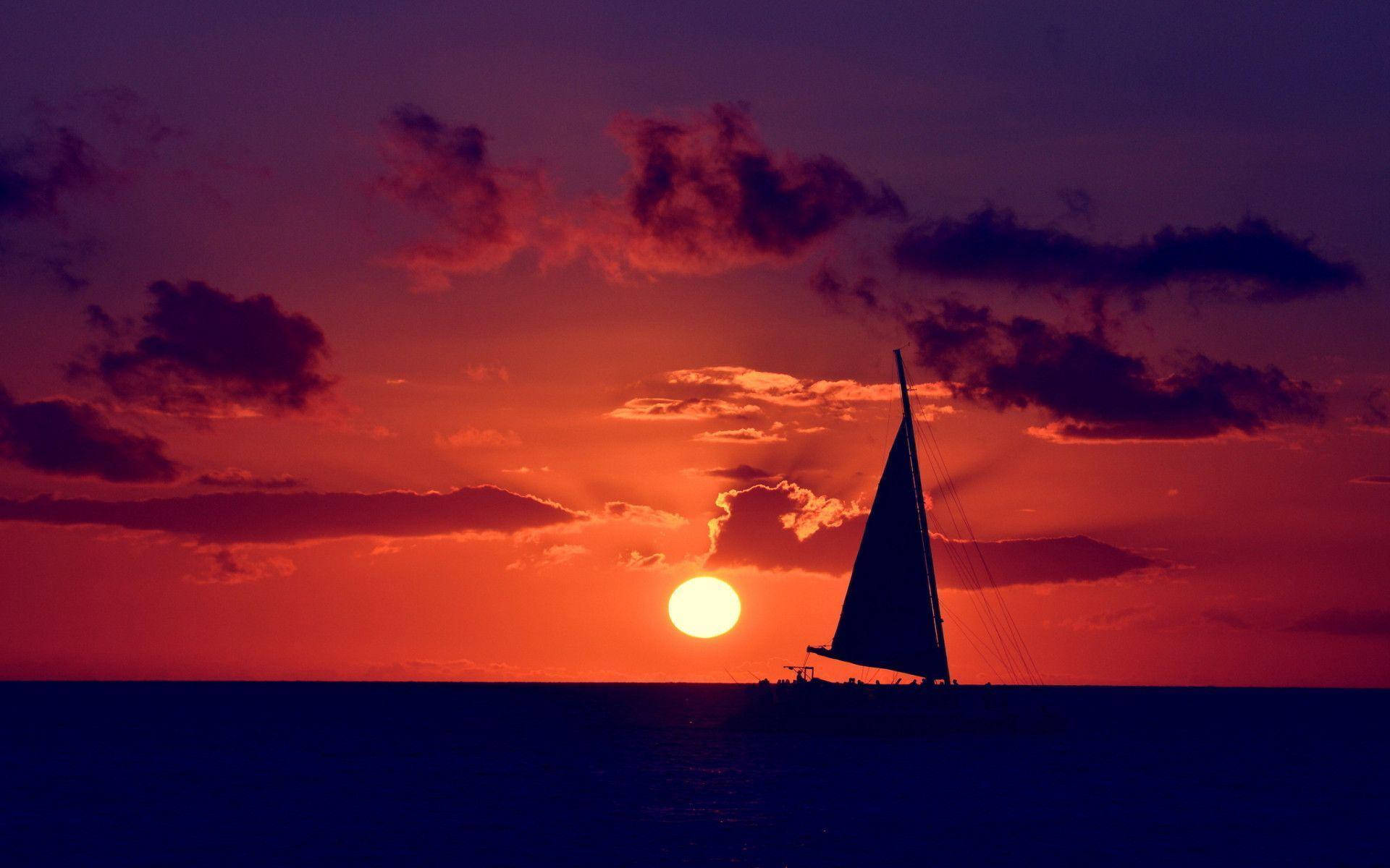 Silhouettesegelboot Ozean Sonnenuntergang Wallpaper
