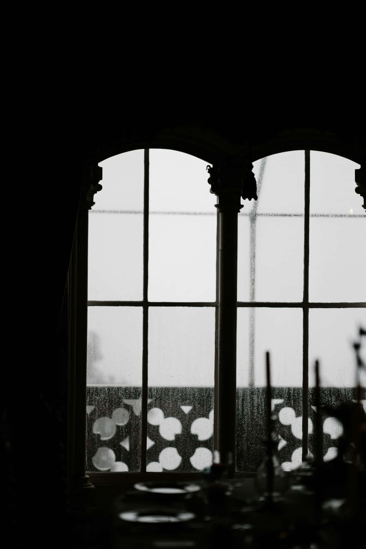 Silhouetted Arched Window Raindrops Wallpaper