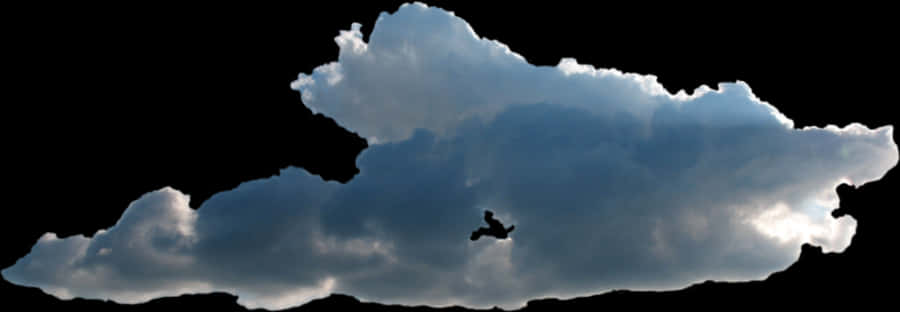 Silhouetted Bird Flying Across Cloudy Sky PNG