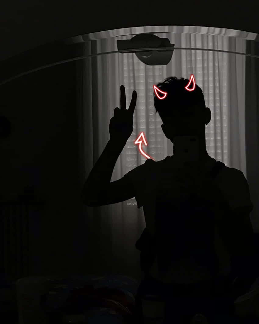 Silhouetted Demon Peace Sign Wallpaper
