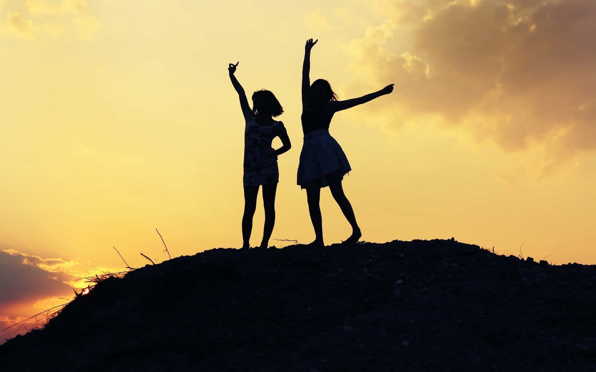 Silhouetted Friends Sunset Celebration Wallpaper