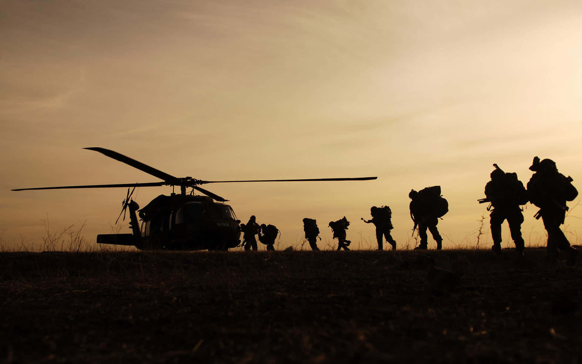 Silhouetted Soldiers Helicopter Sunset Wallpaper