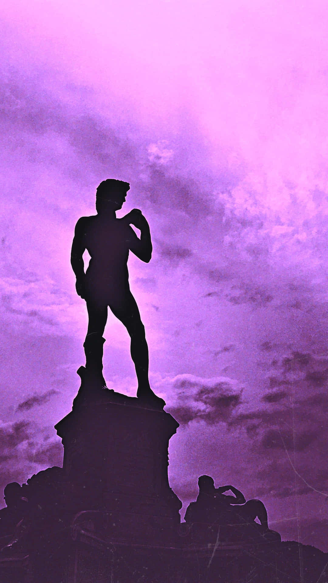 Silhouetted Statue Against Purple Sky Wallpaper