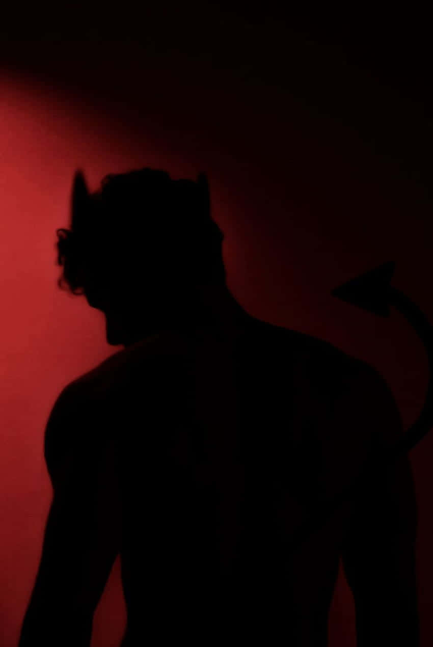 Silhouetteof Demon Figure Wallpaper