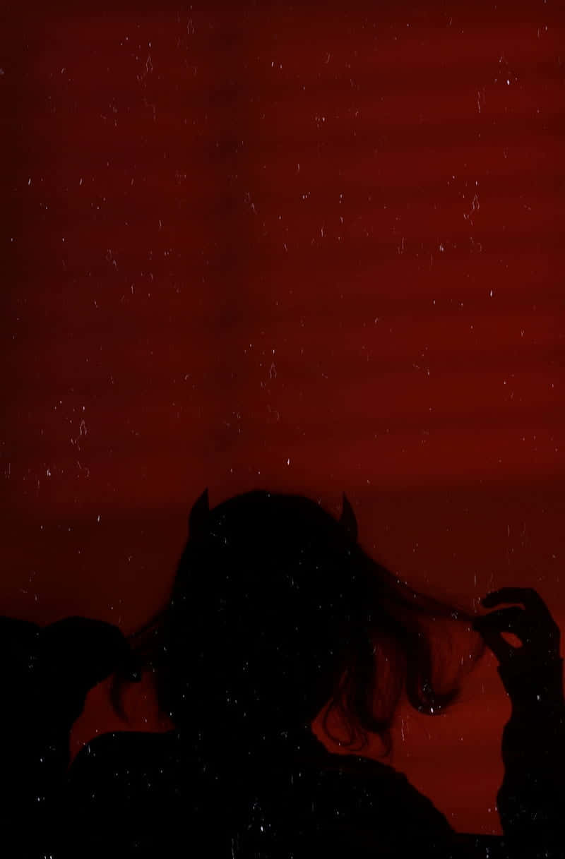Silhouetteof Demonin Red Ambiance Wallpaper