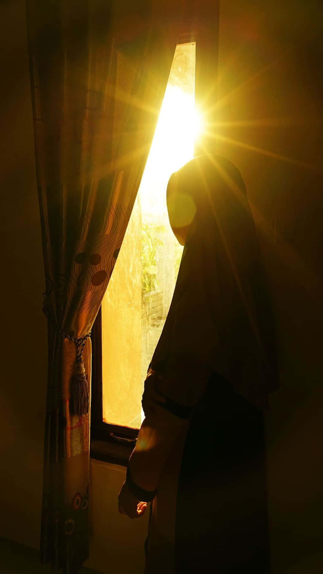 Silhouetteof Muslim Womanat Sunrise Wallpaper