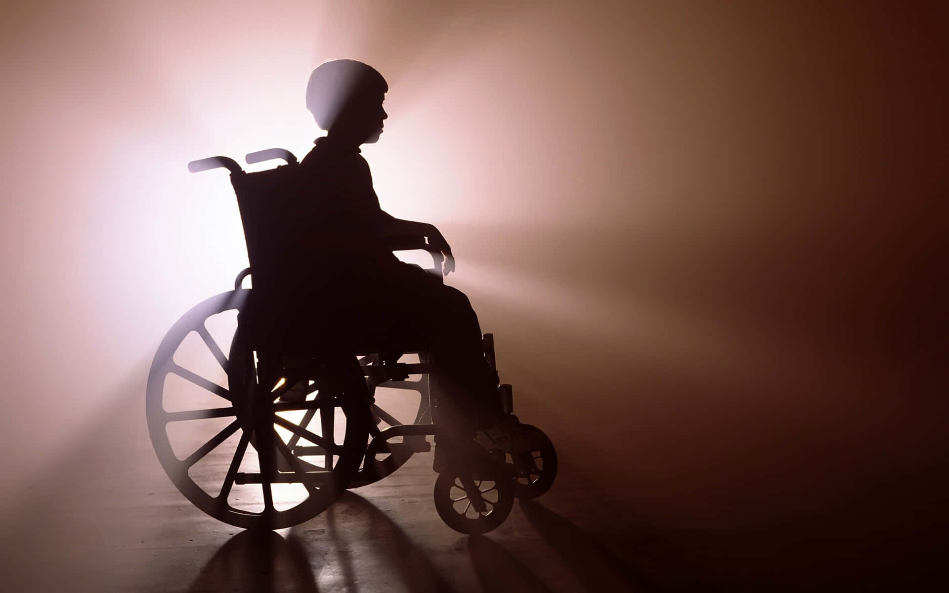 Silhouetteof Personin Wheelchair Wallpaper