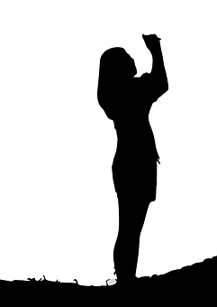 Silhouetteof Woman Raising Hand PNG