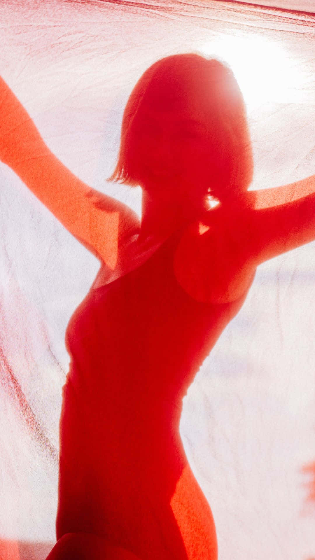 Silhouetteof Womanin Red Dress Wallpaper