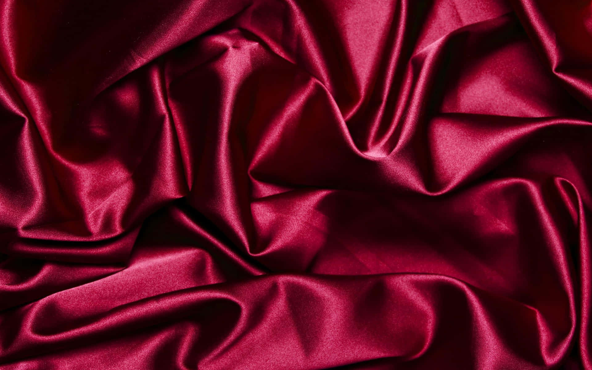 A Red Satin Fabric With A Smooth Texture