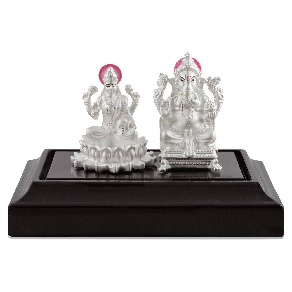 Statuetted'argento Di Ganesh Lakshmi Sfondo