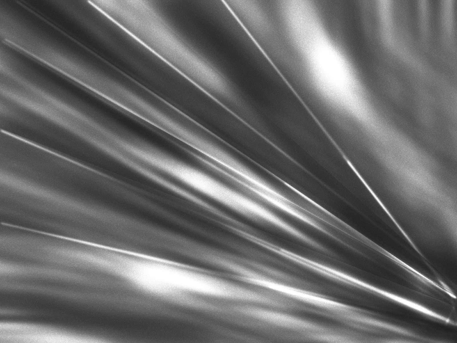Metalliskglans - En Skimrande Silverfolie-bakgrund
