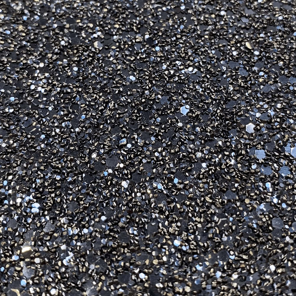 A Close Up Of A Black And Silver Gravel