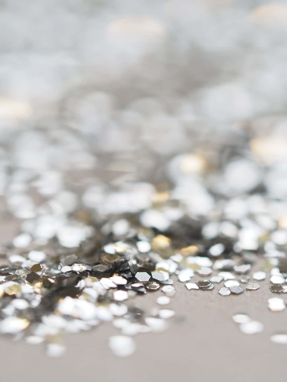 A Close Up Of Silver And Gold Glitter
