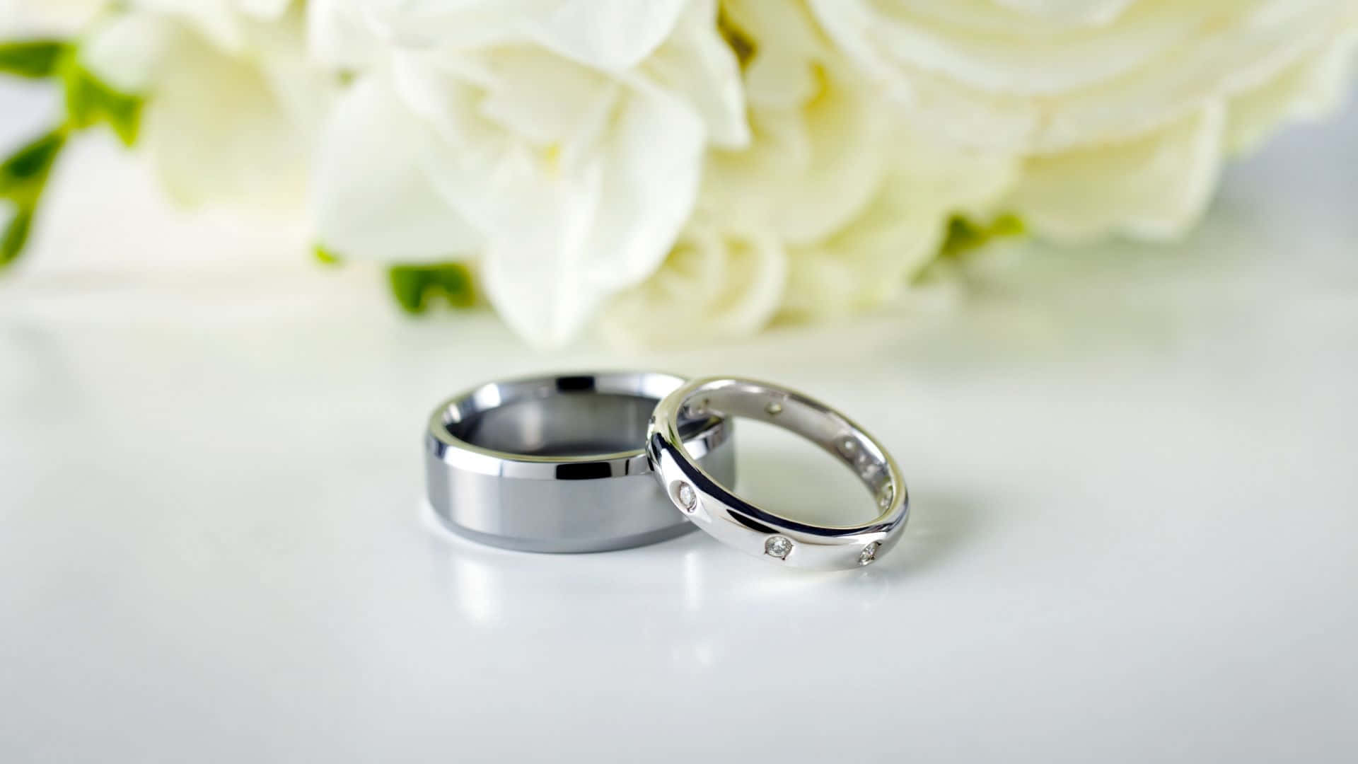 Silver Wedding Ring With White Flowers Wallpaper