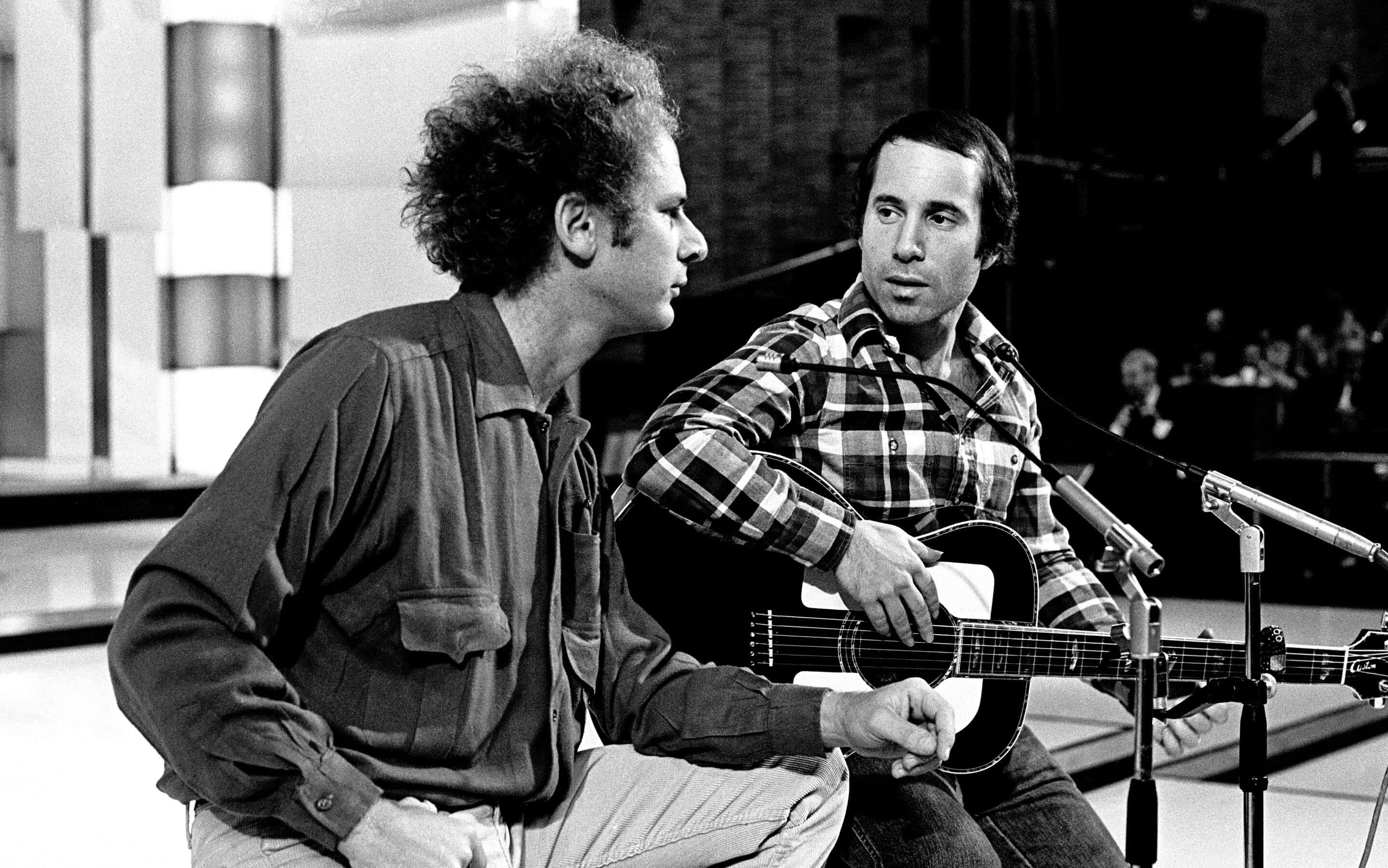 Download Simon And Garfunkel Onstage Moment Wallpaper