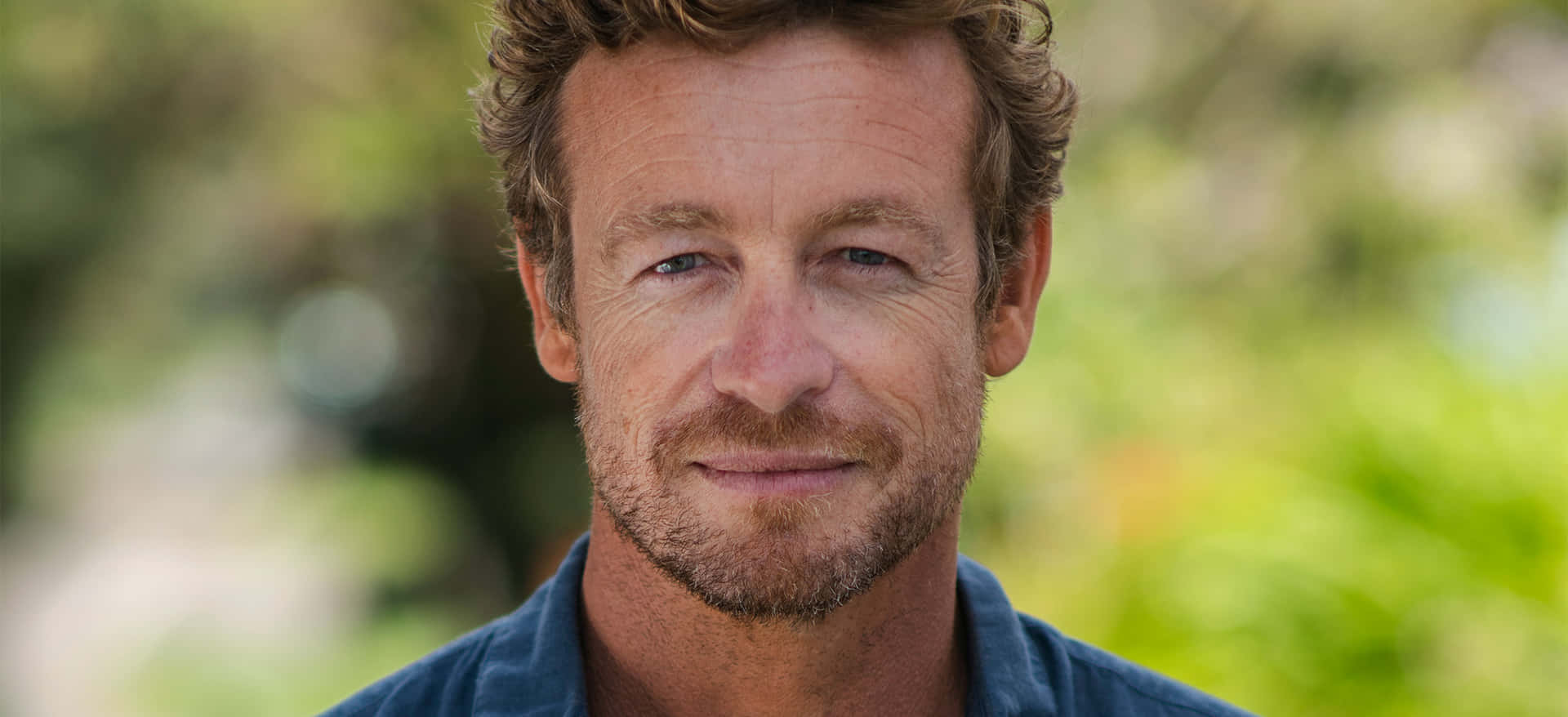 Simon Baker Smiling Outdoors Wallpaper