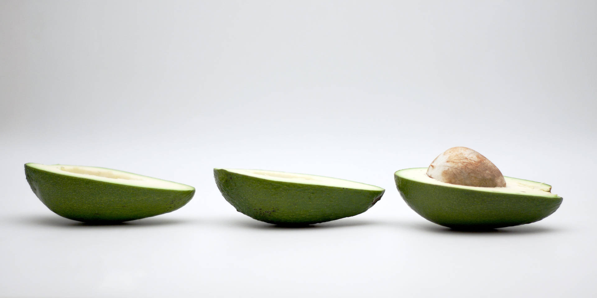 Simple Avocado Fruit In Halves Display Wallpaper