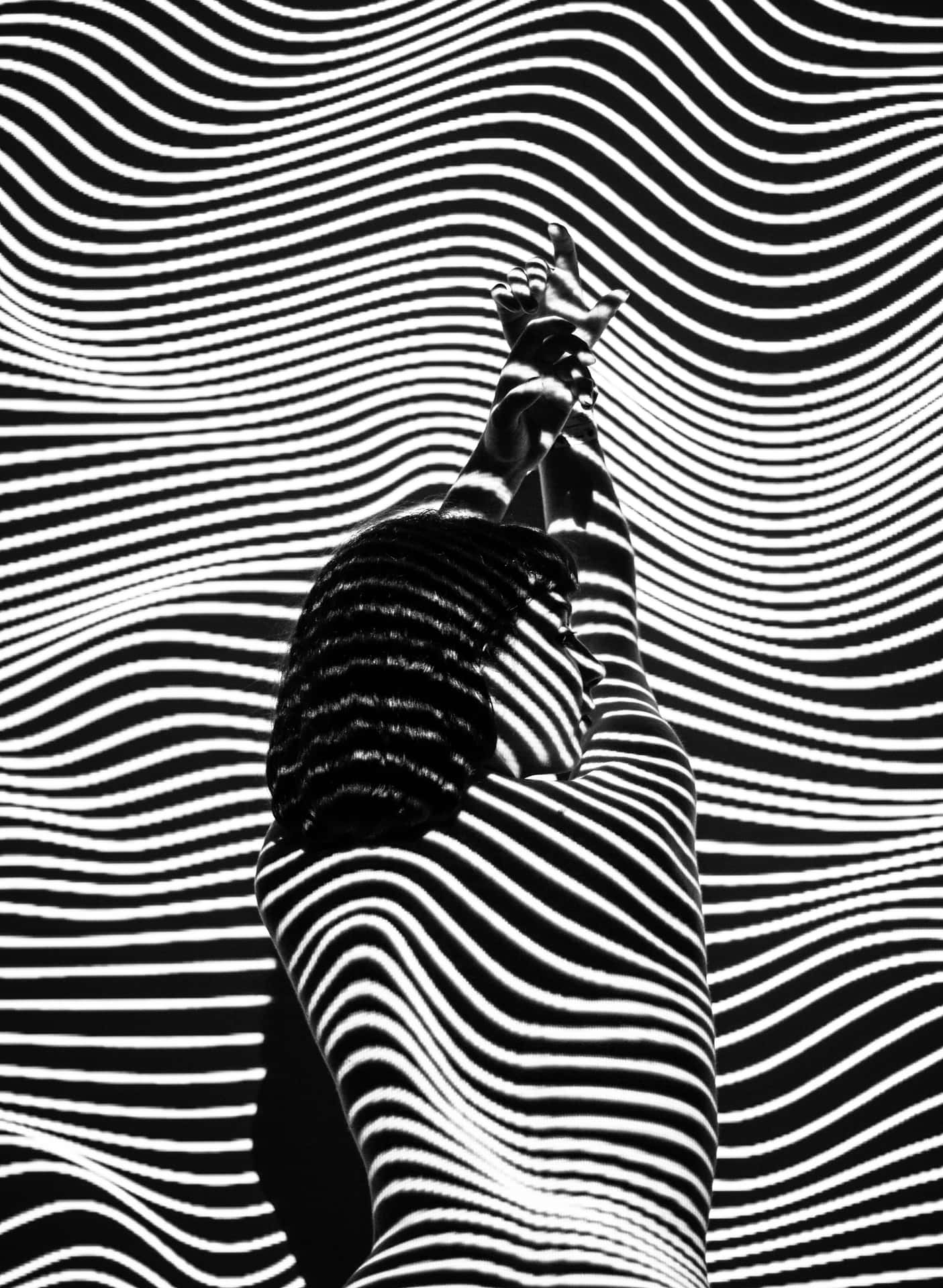 A Black And White Image Of A Person In A Wave Wallpaper