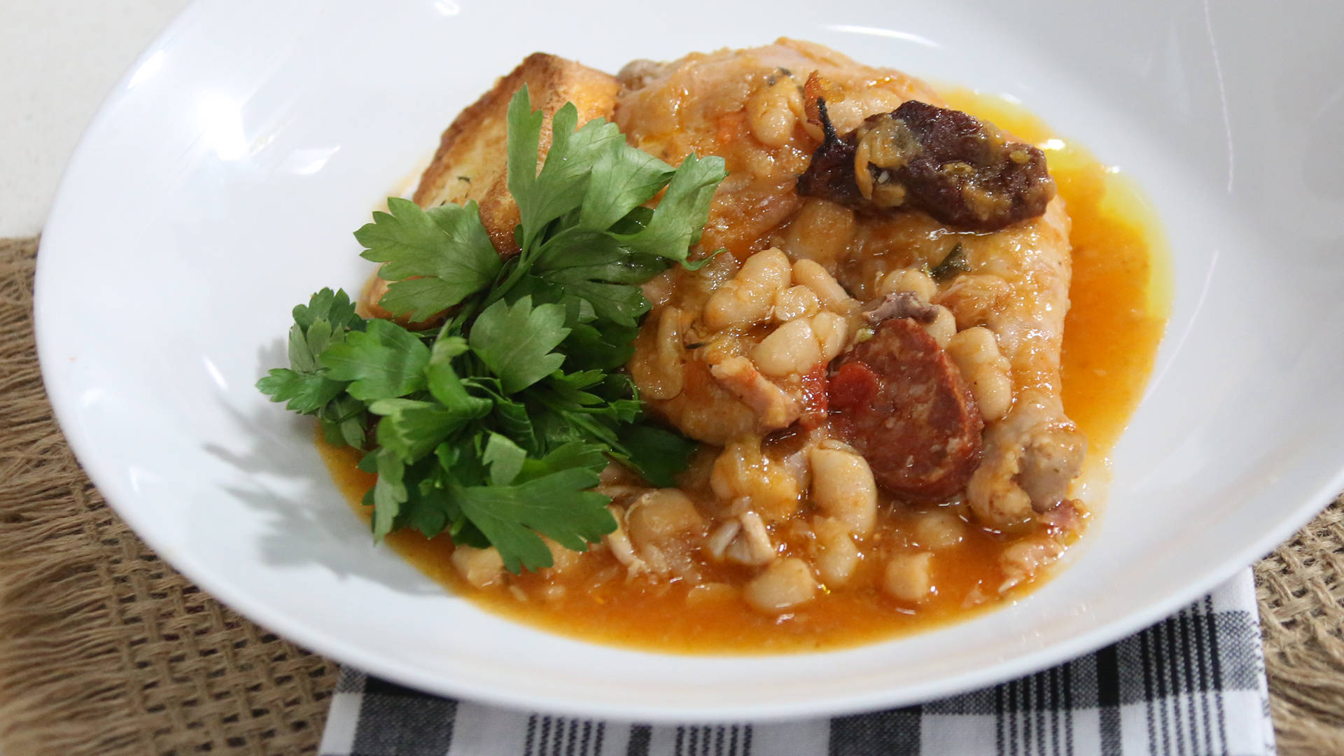 "Delicious Cassoulet Dish Garnished with Parsley and Crostini" Wallpaper