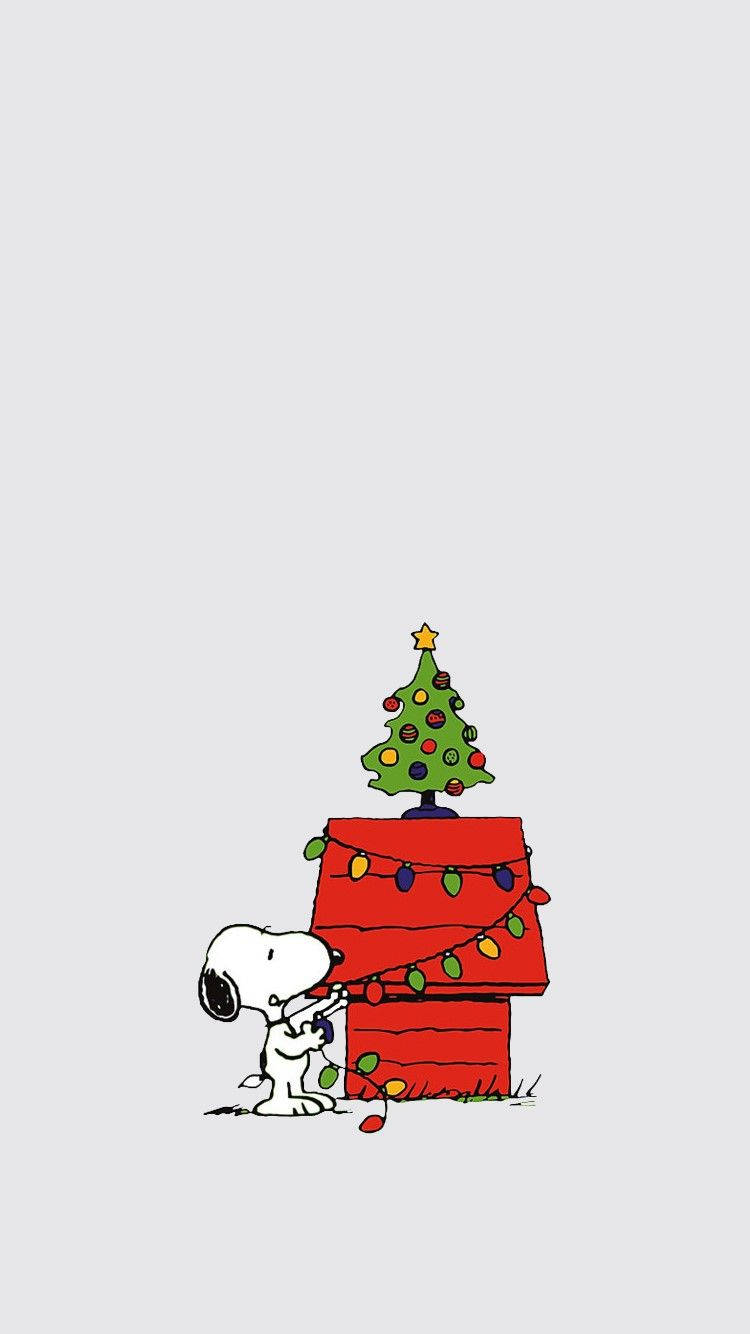 Enkelgullig Jul-tema Iphone-tapet Med Snoopy. Wallpaper