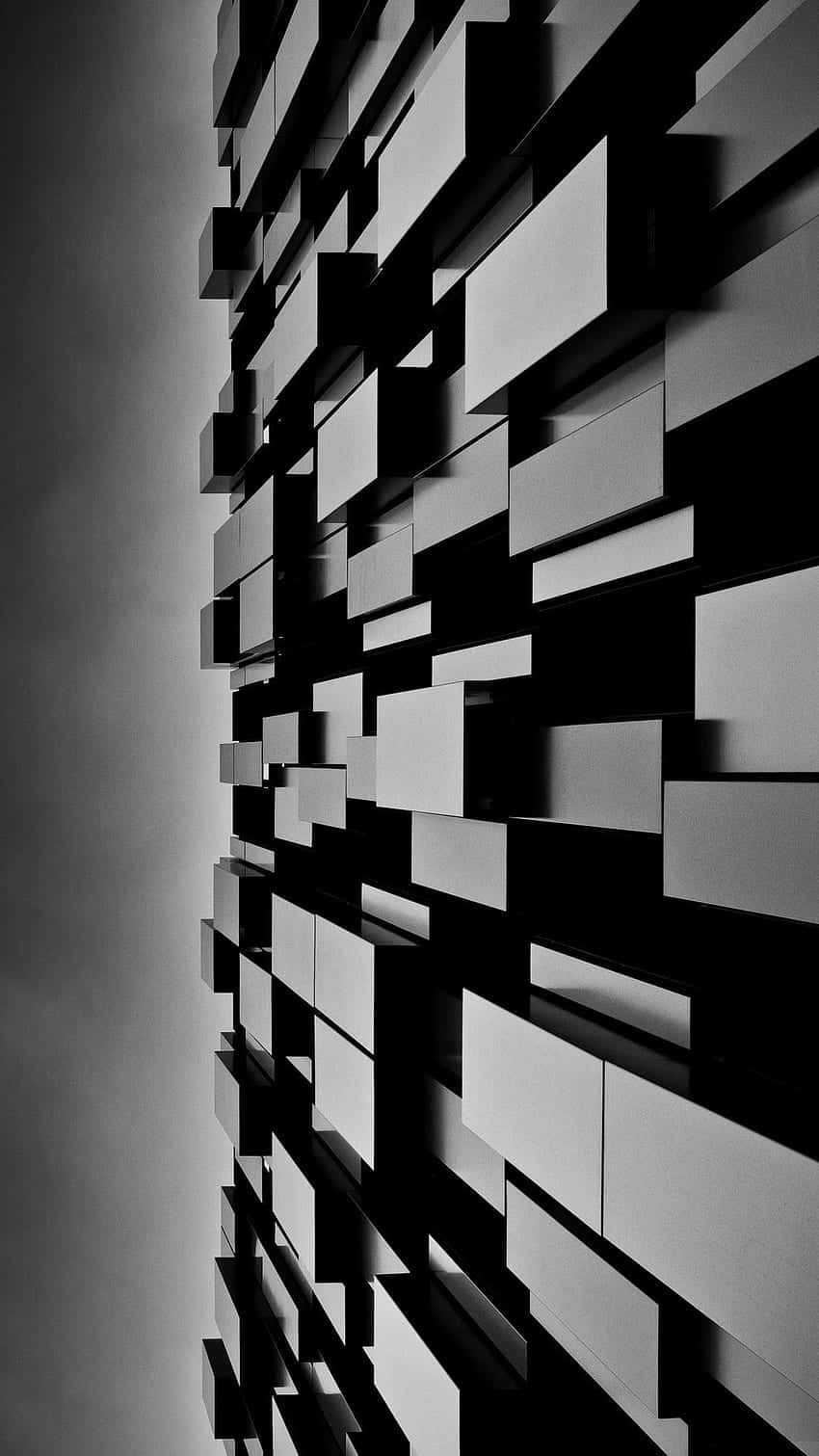 Unafoto En Blanco Y Negro De Un Edificio Con Cuadros. Fondo de pantalla
