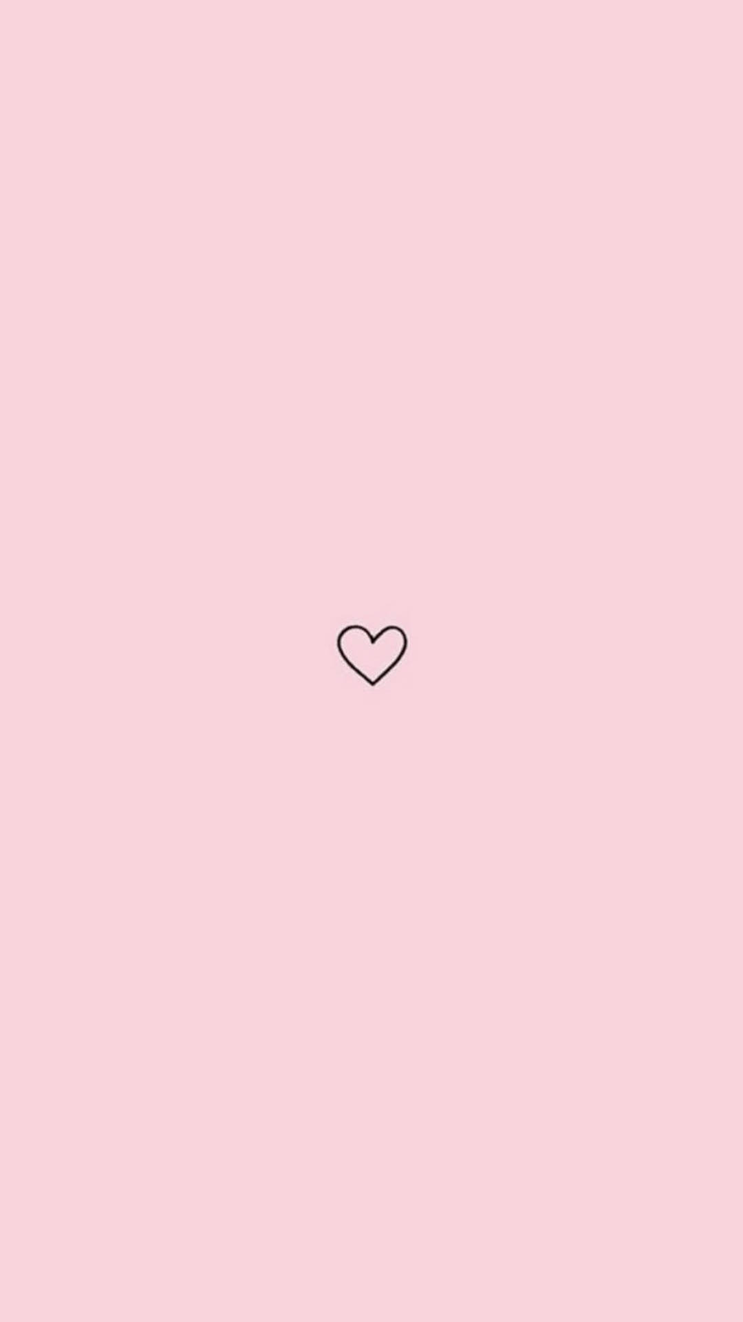 Hình nền hình trái tim màu hồng đơn giản sẽ truyền tải cho bạn thông điệp về sự đơn giản và sự chân thành trong tình yêu. Với bức hình giản đơn này, bạn cảm nhận được sự ấm áp, sự yên bình, đong đầy cảm xúc trong tim mình.