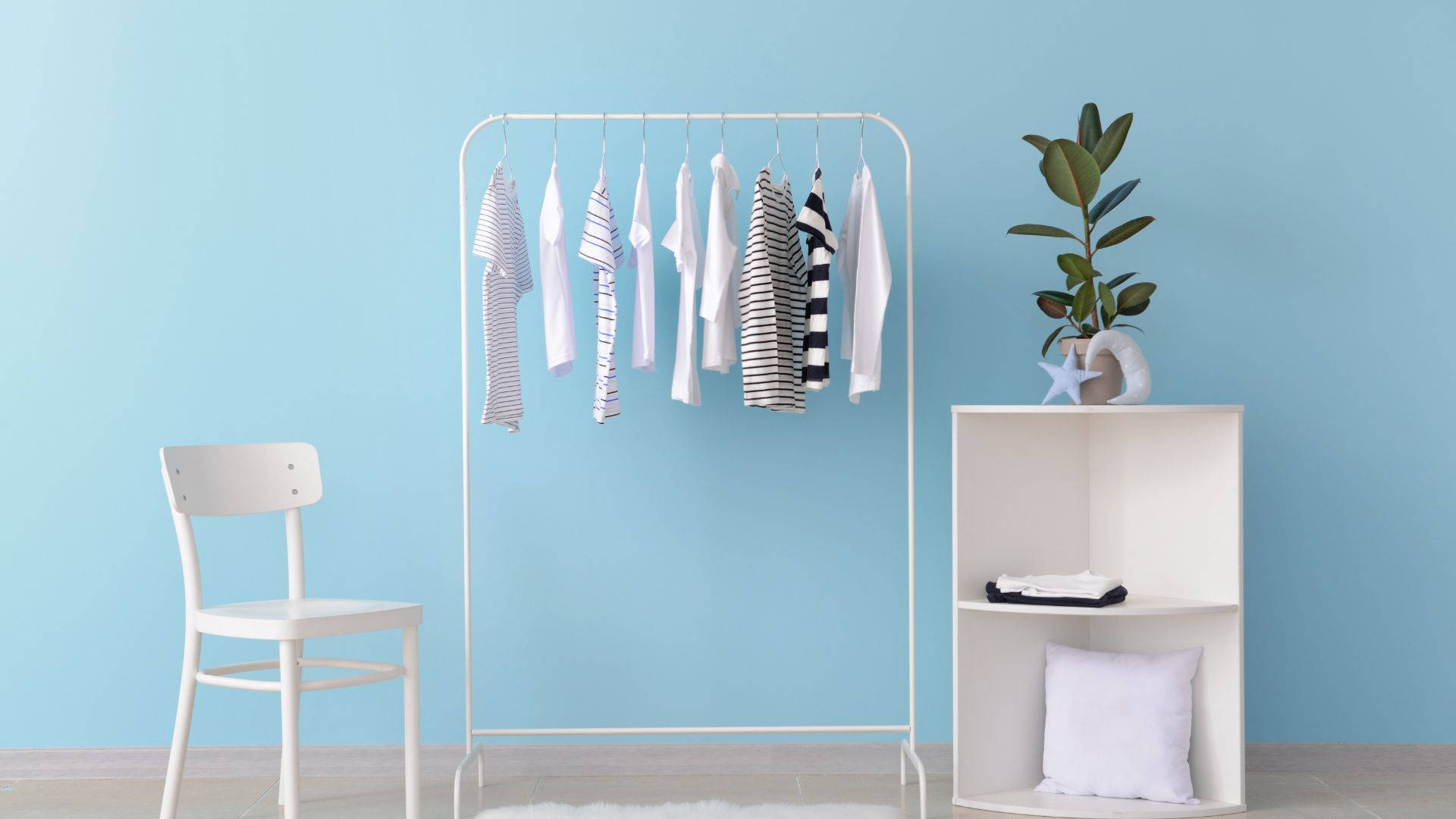 Simplistic Clothes Rack Furniture Wallpaper