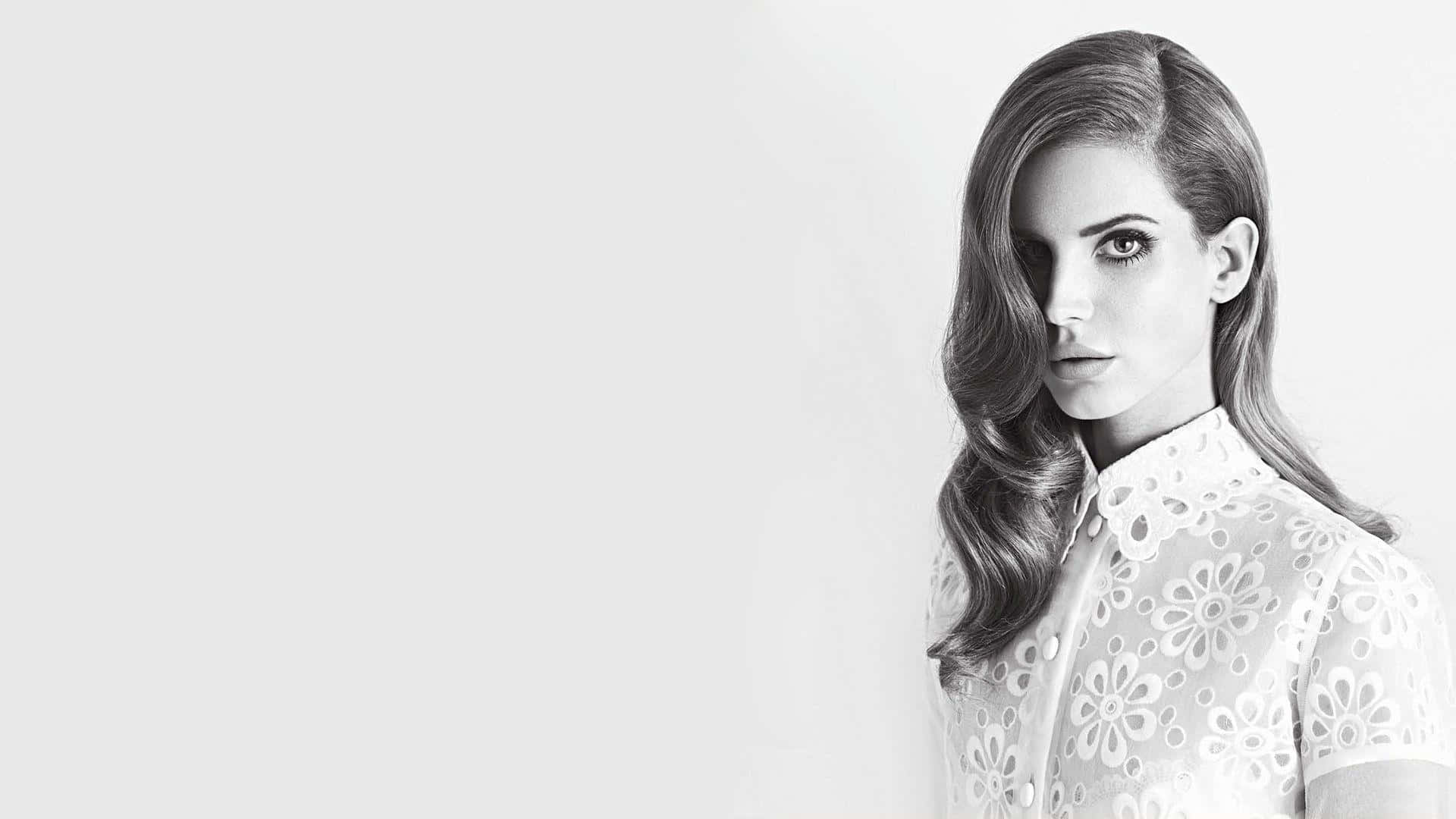 Singer Lana Del Rey Performing Live On Stage Wallpaper