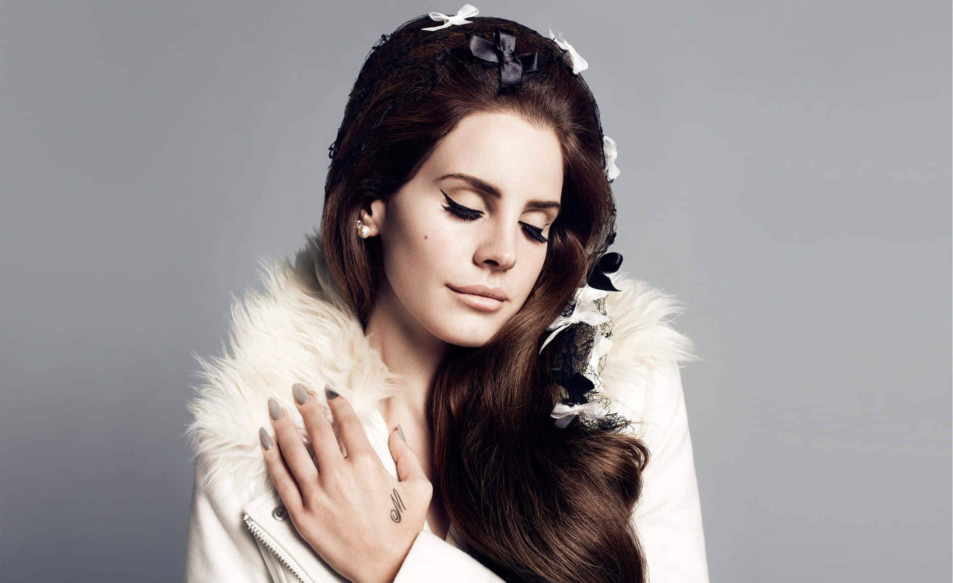 Singer Lana Del Rey Posing In A Beautiful Red Dress Wallpaper