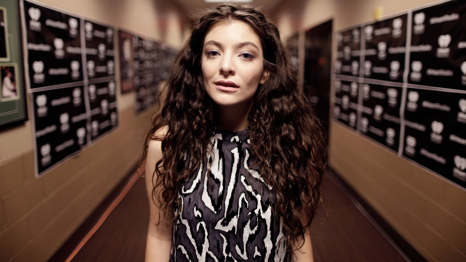 Singer Lorde In Hallway Background