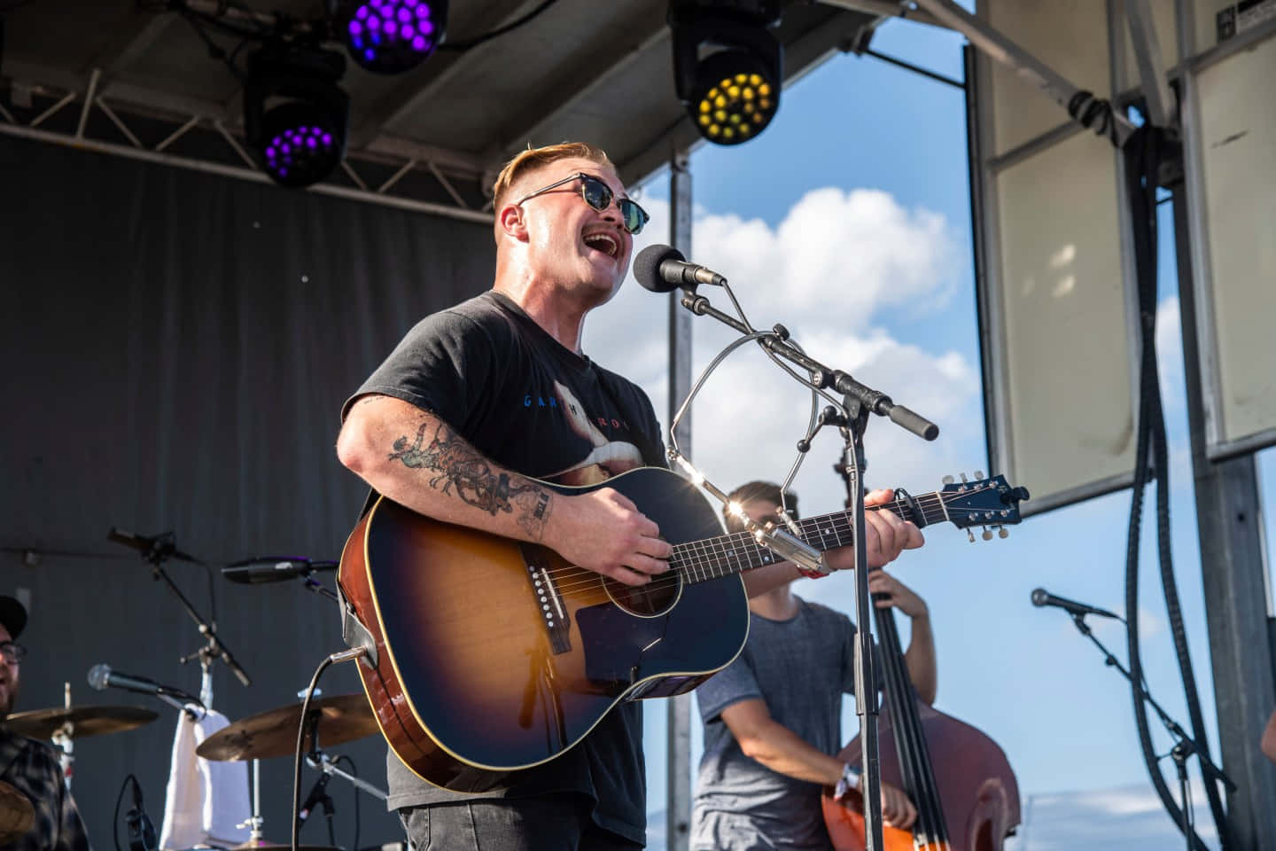 Singer Songwriter Performing Outdoor Concert Wallpaper