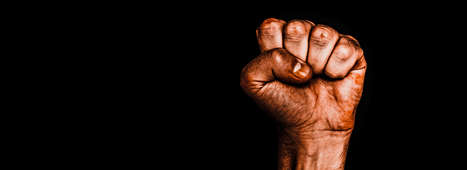 Single Raised Fist Against Racism Wallpaper