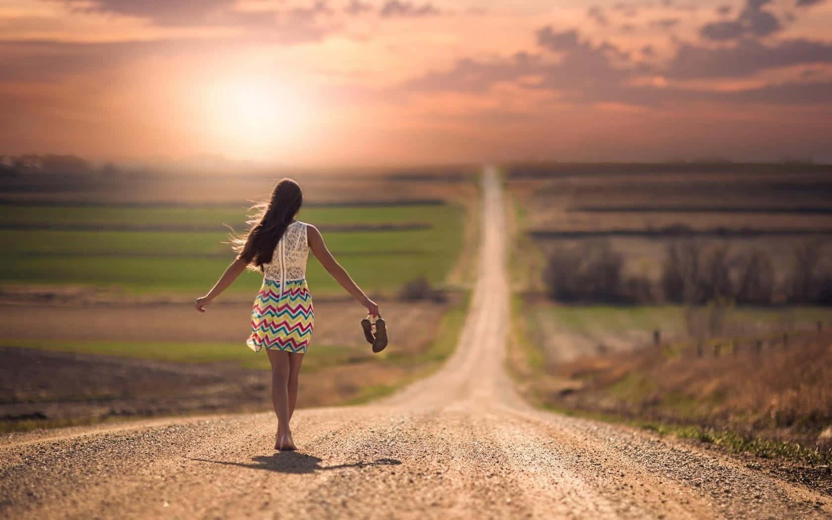 Single Woman On An Empty Road Background