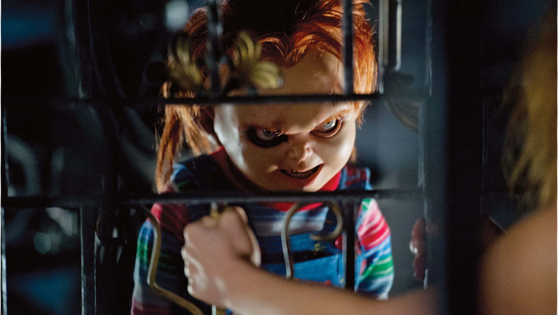 Sinister Grin - A Close-up Shot Of Chucky, The Infamous Horror Film Icon.