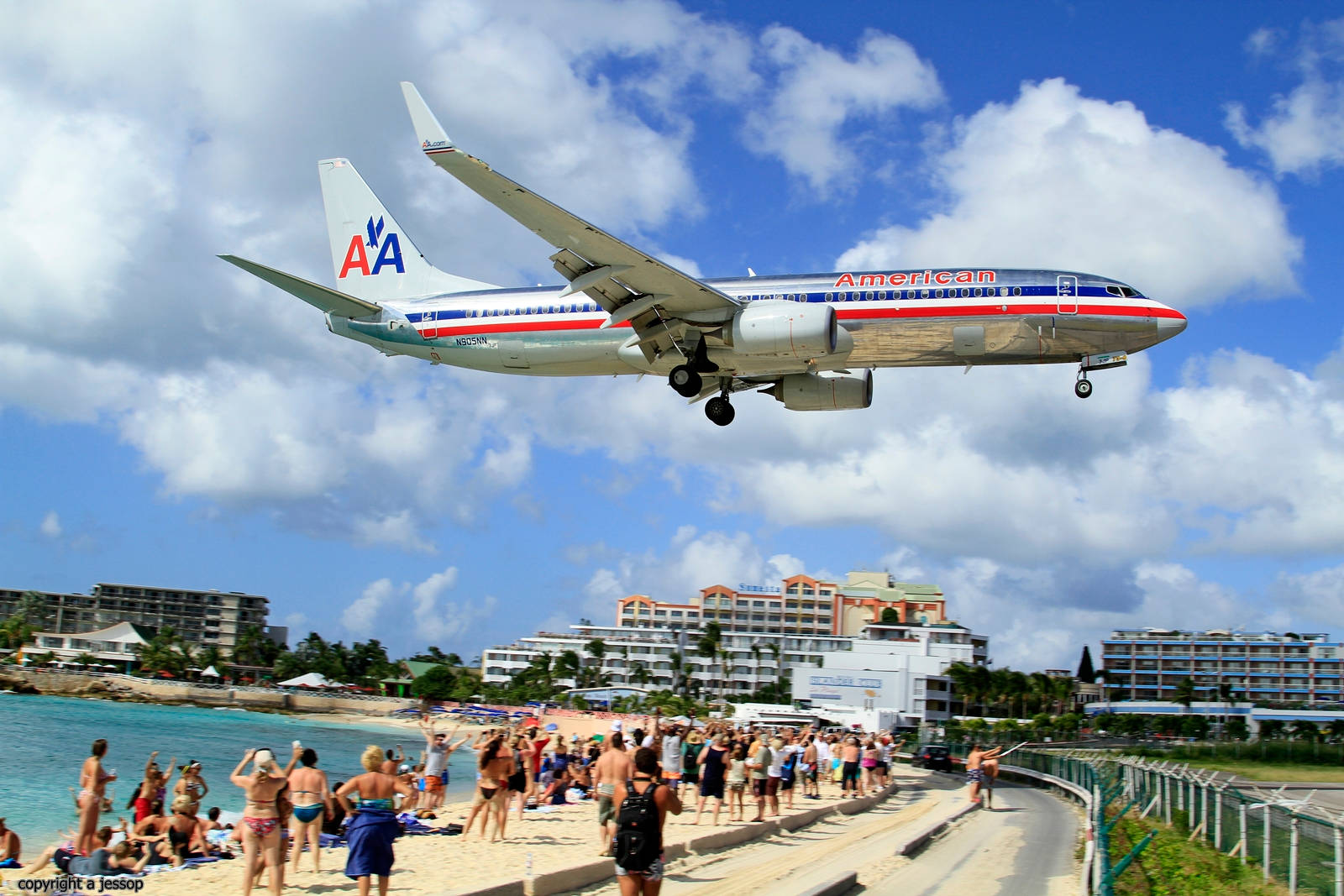 Sint Maarten Tourists Stunned By A Landing Plane Wallpaper