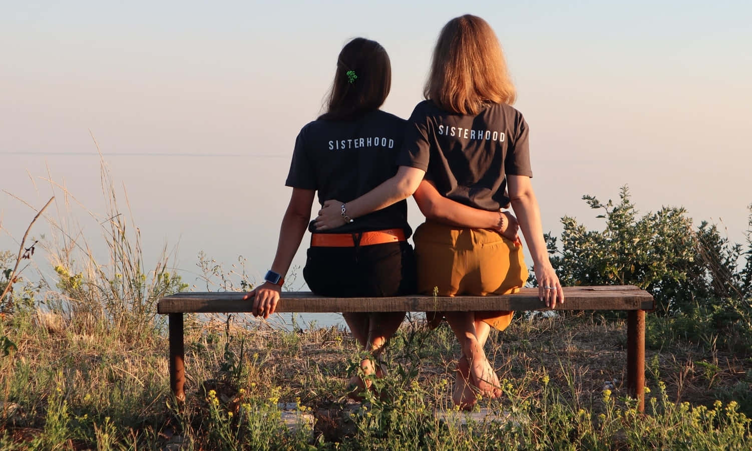 Sisterhood Bonding Overlooking Nature Wallpaper