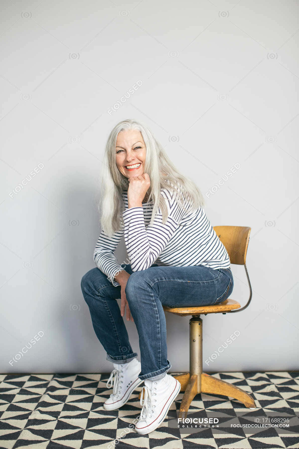 A Woman Sitting On A Chair