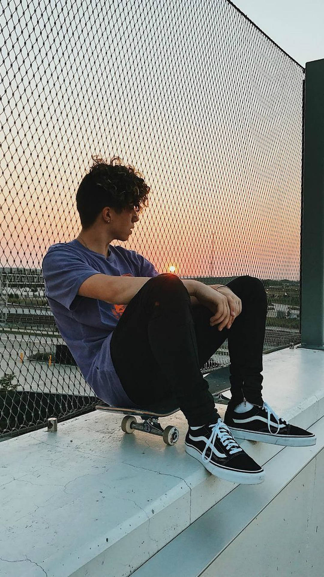 Sitting Skater Boy Aesthetic Wallpaper