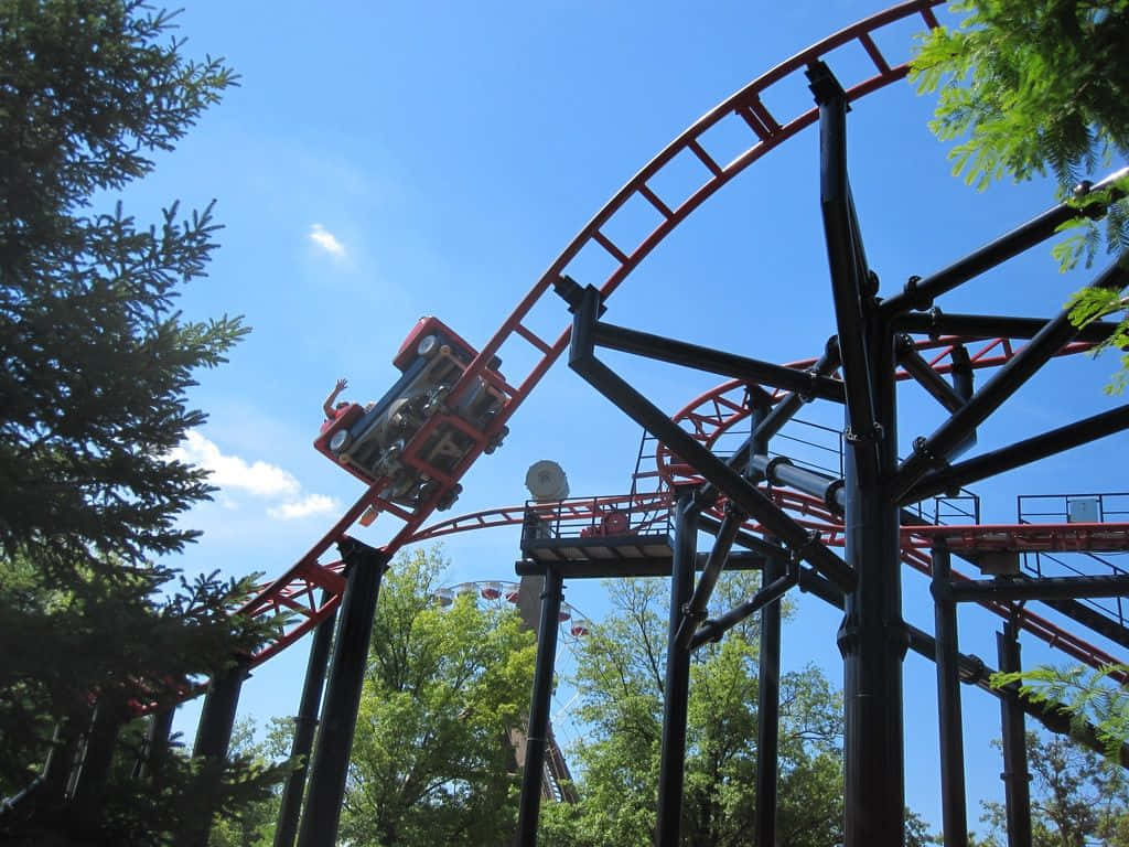 A Roller Coaster Ride With A Red And Black Track