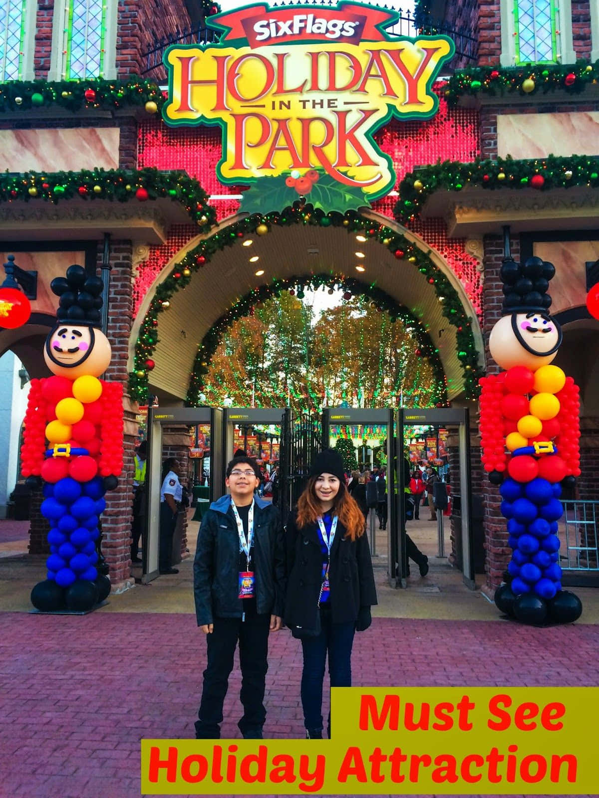 Two People Standing In Front Of A Holiday Park