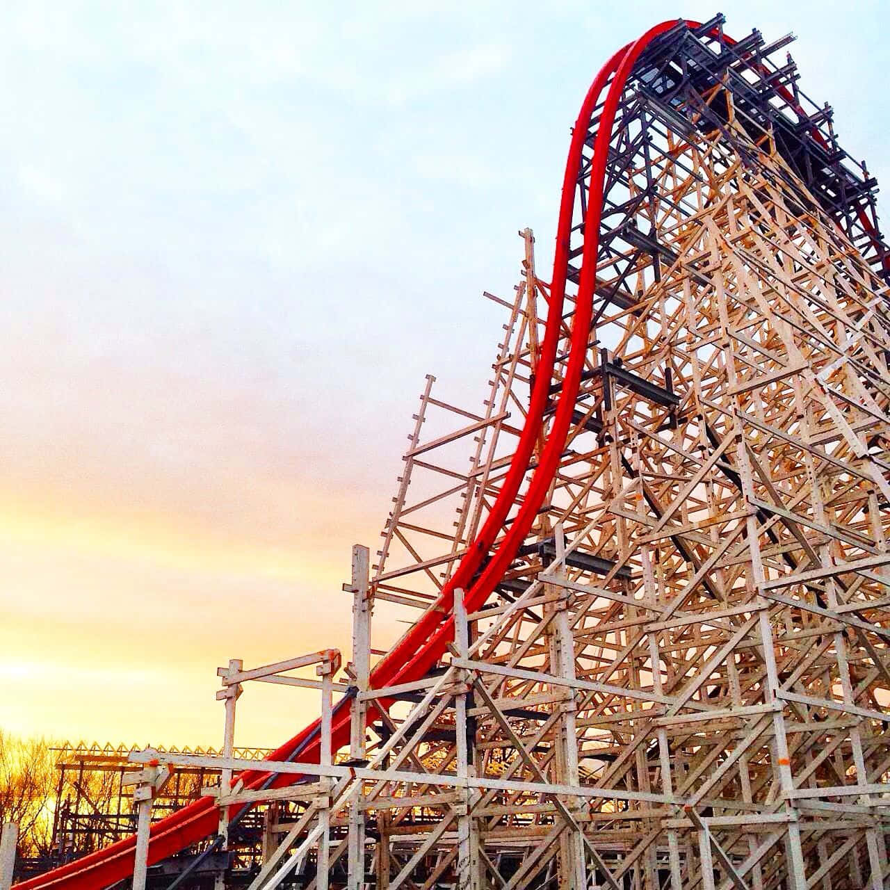 A Roller Coaster With A Red And White Striped Ride