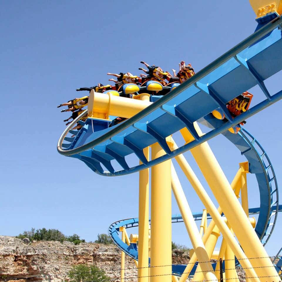 A Roller Coaster With Blue And Yellow Colors