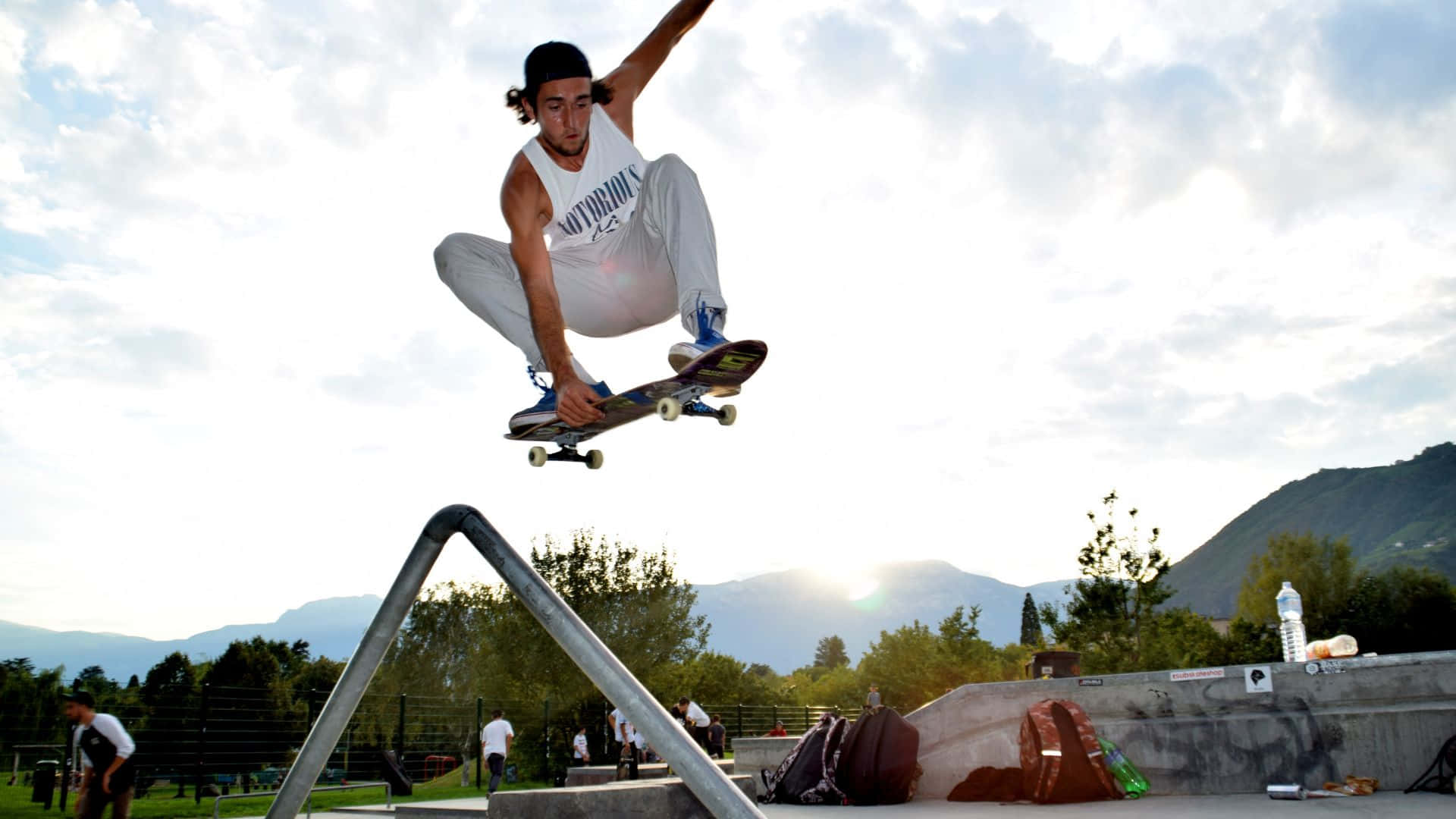 A skateboarder performing a jump in a skate park