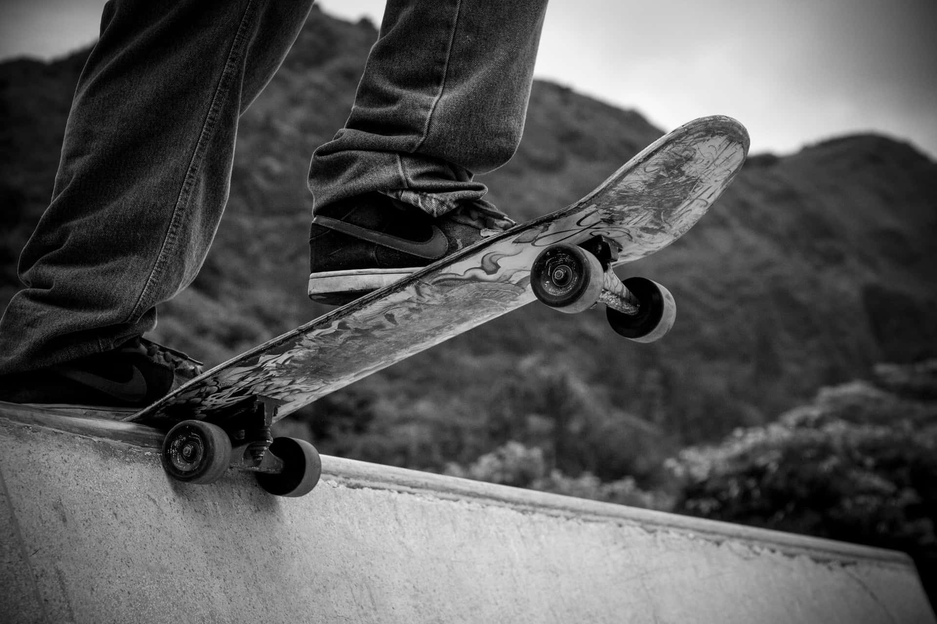 Skateboarder_ Tailslide_ Preparation_ Black_and_ White Wallpaper
