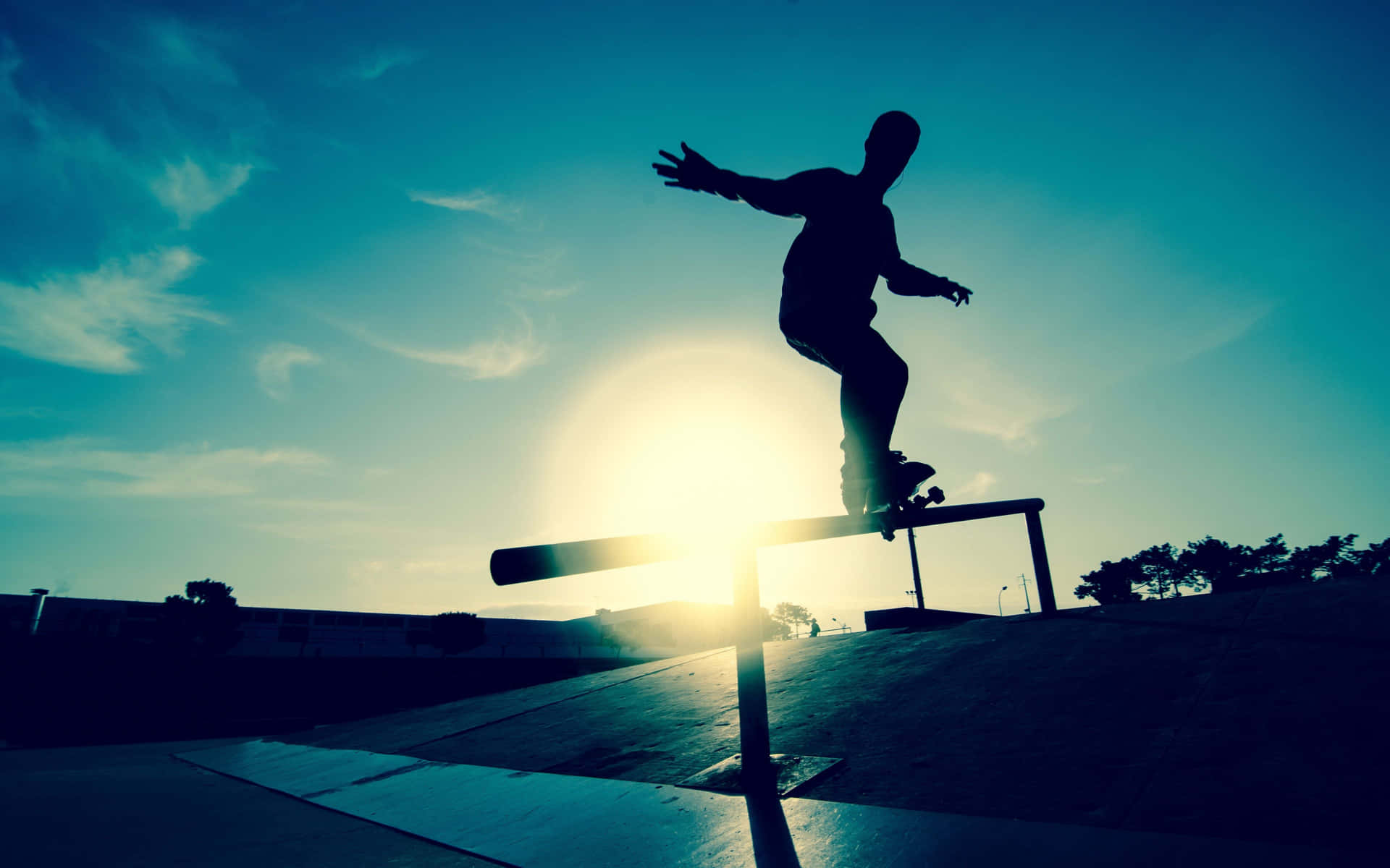 A Skateboarder Doing A Trick On A Rail